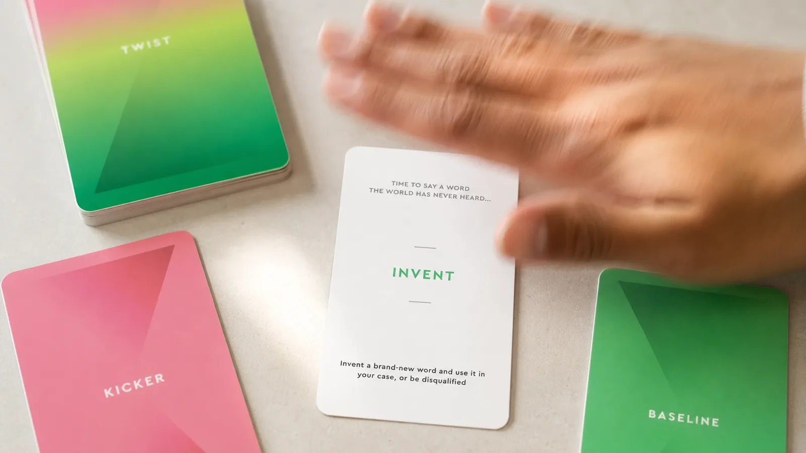 The Invent twist card being slapped onto the table mid-game